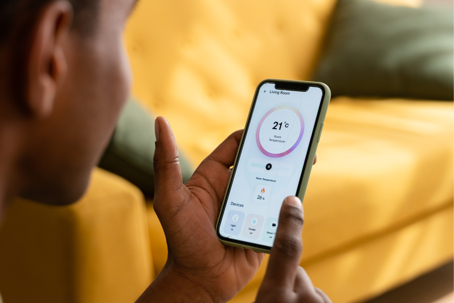 person controlling ac from smartphone