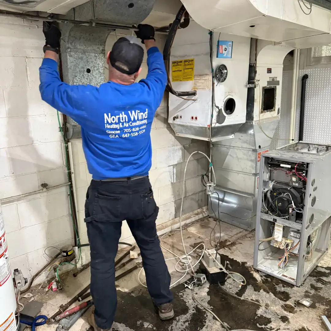 hvac technicians repairing furnaces