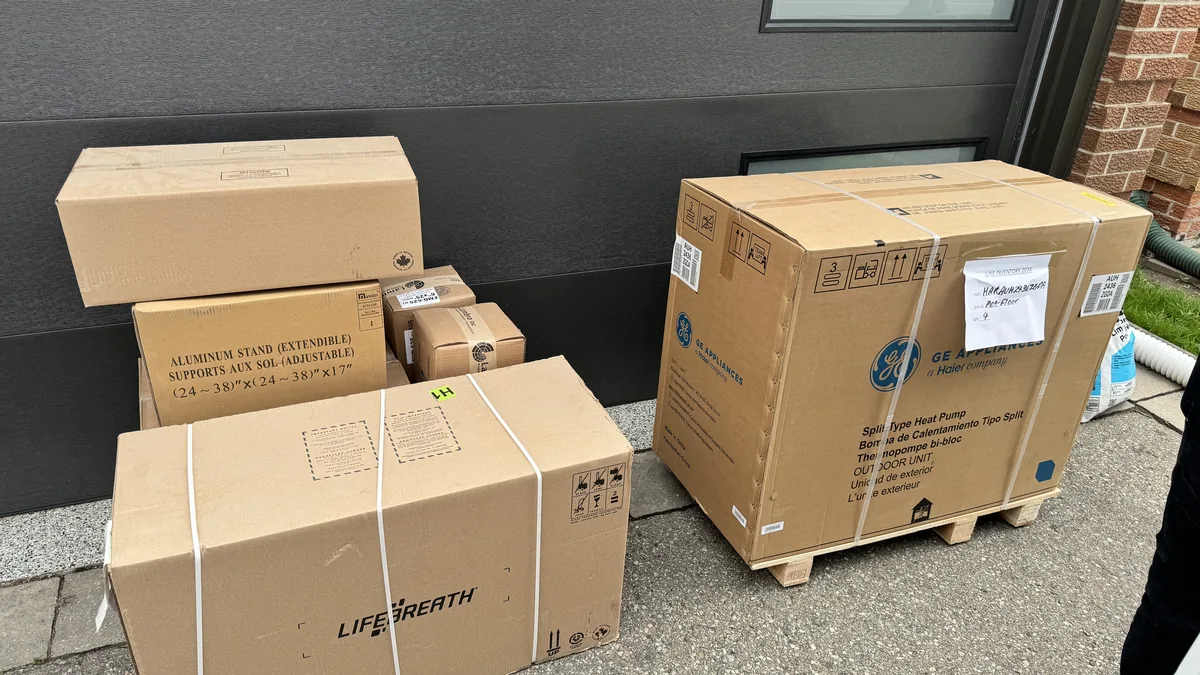 HVAC technician cleaning and inspecting AC evaporator coils during a tune-up service in the GTA