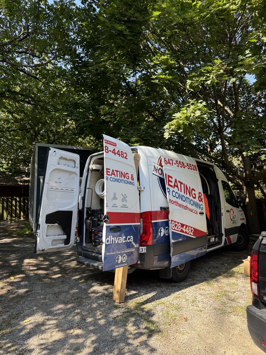 Central air conditioner outdoor condenser unit installed in a Toronto GTA residential backyard