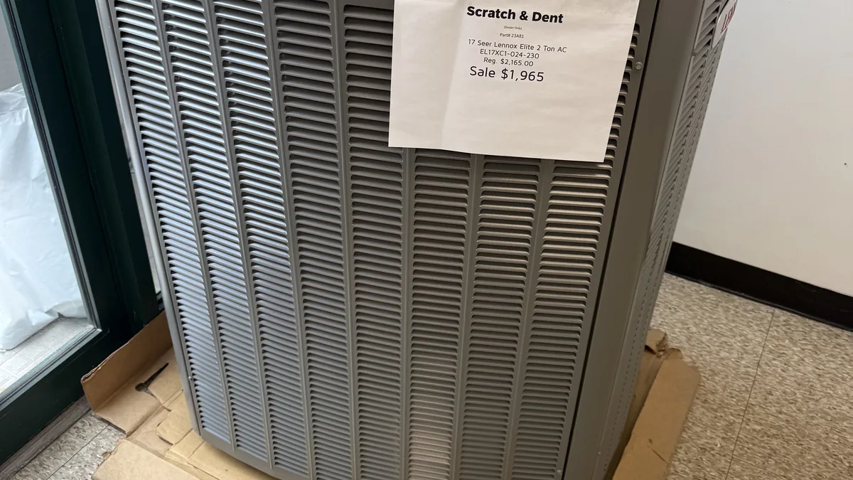 Ontario homeowner reviewing energy rebate paperwork for a heat pump installation in 2026